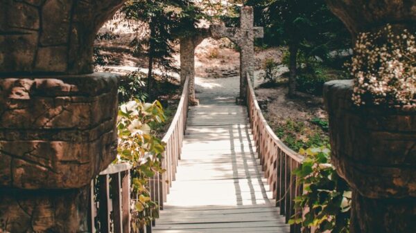 A stone bridge with a walkway going through it