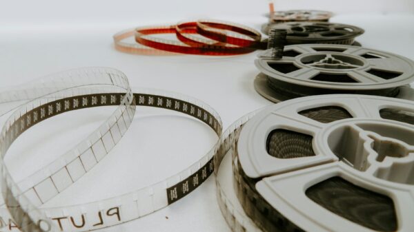 four reel films lying on white table
