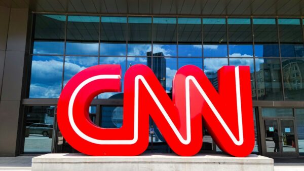 the cnn logo is displayed in front of a building