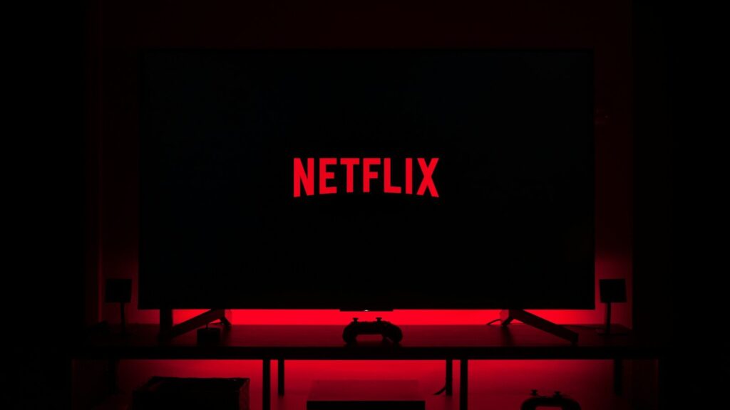 flat screen television displaying Netflix logo