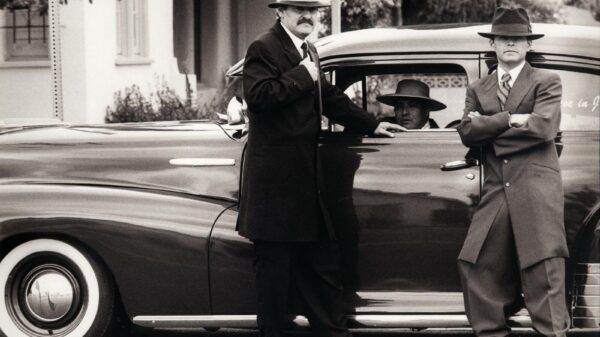 Three men in vintage gangster attire with classic car, Tustin, CA.