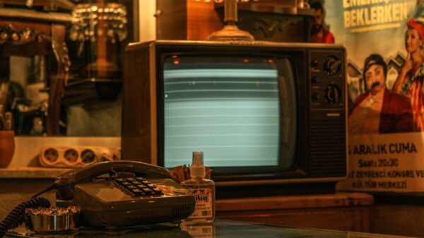 an old fashioned telephone sitting on top of a glass table