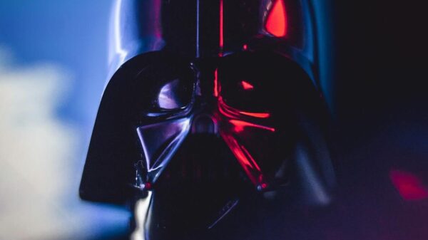 Close-up of a Darth Vader mask with striking lighting effects, showcasing cinematic appeal.