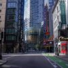 A quiet street in downtown Boston showcasing iconic Paramount marquee and urban architecture.