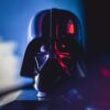 Close-up of a Darth Vader mask with striking lighting effects, showcasing cinematic appeal.