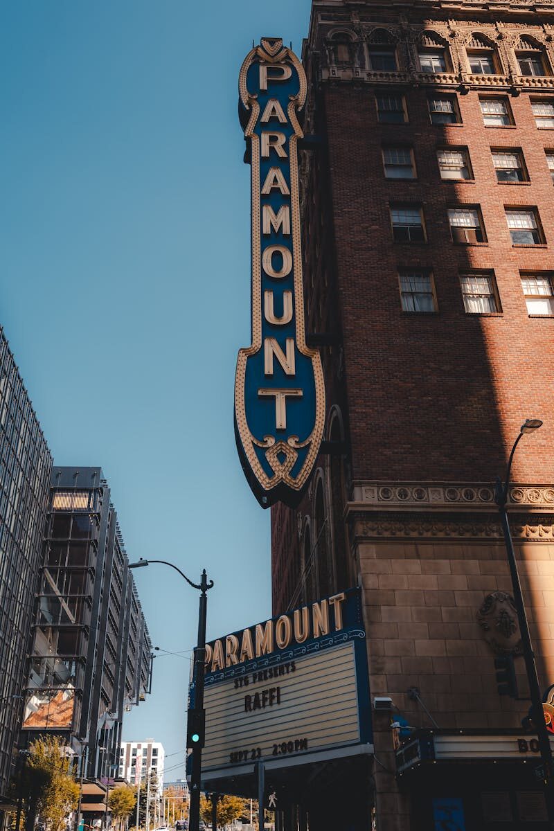 Vertical shot of Paramount Theater facade, capturing urban architecture and iconic signage.