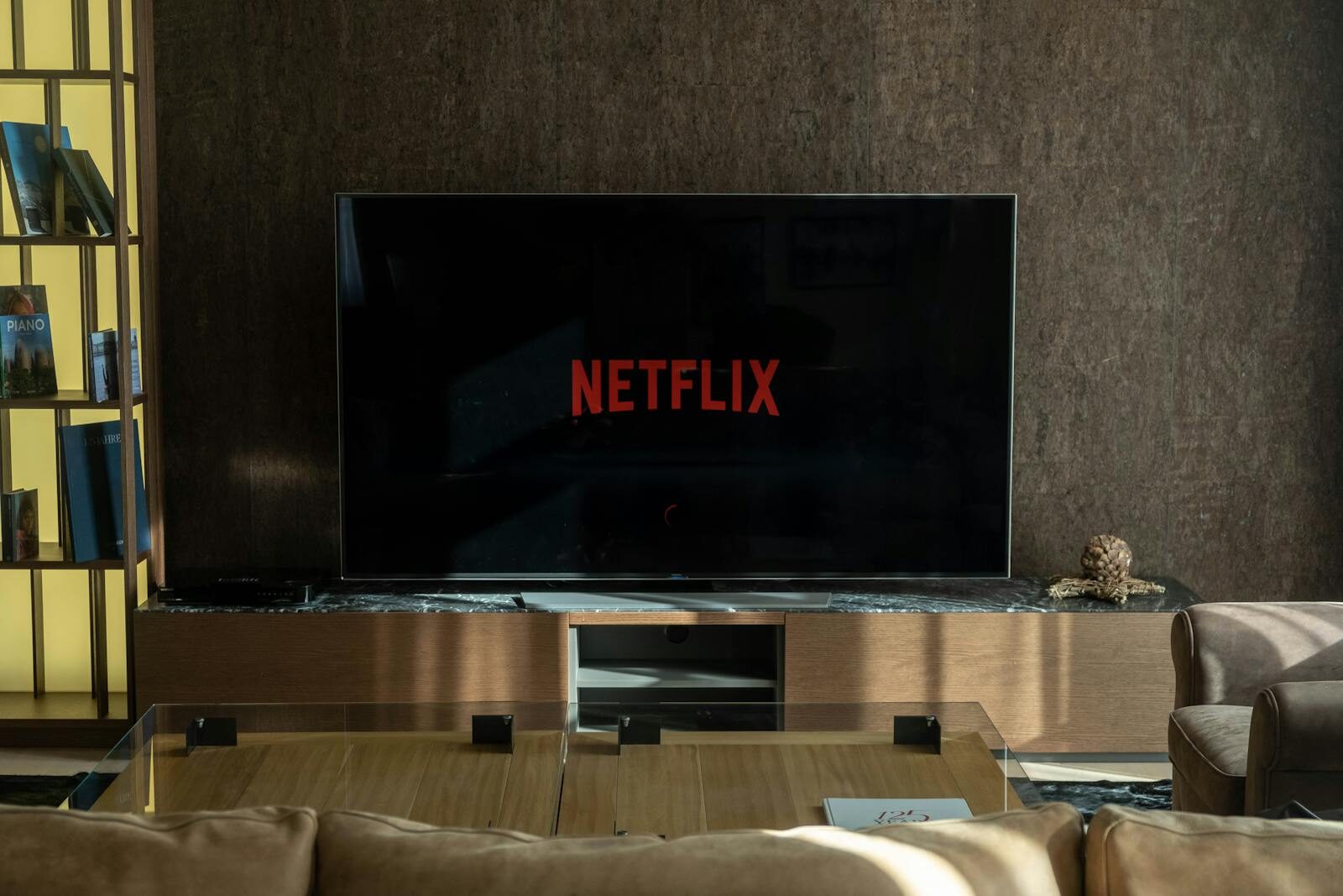 Cozy living room featuring a large TV displaying Netflix, perfect for entertainment.