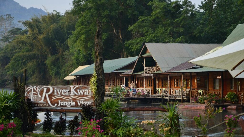 Capture tranquility at the River Kwai Jungle View in Thailand. Perfect riverside escape amidst lush greenery.