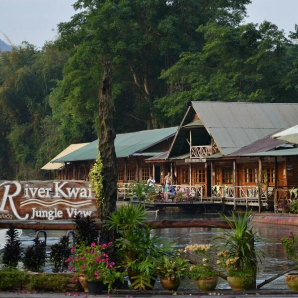 Capture tranquility at the River Kwai Jungle View in Thailand. Perfect riverside escape amidst lush greenery.