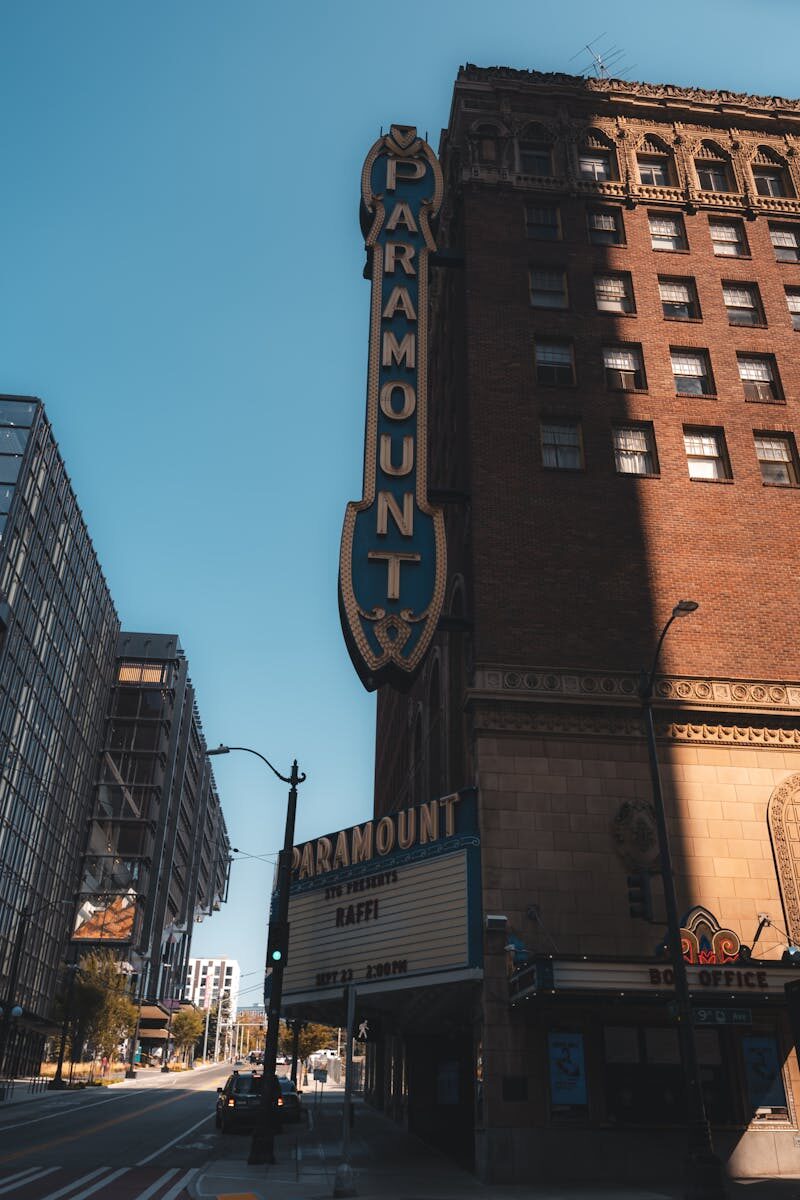 Vertical shot of Paramount Theater's distinctive facade in city environment.