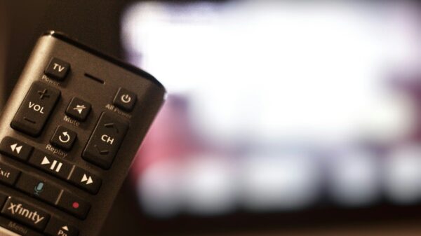 black remote control on brown wooden table