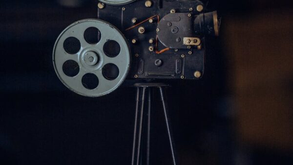 A classic vintage film camera on a tripod, capturing nostalgic cinematic equipment.