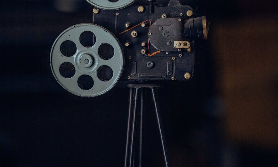 A classic vintage film camera on a tripod, capturing nostalgic cinematic equipment.