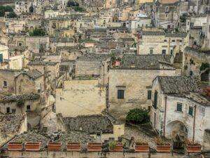 A picturesque view of the ancient stone architecture and rooftops of Matera, Italy.