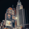 Night view of the iconic New York-New York Hotel in Las Vegas with brilliant lights and modern architecture.