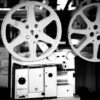 Black and white image of a retro film projector showcasing cinematographic equipment.