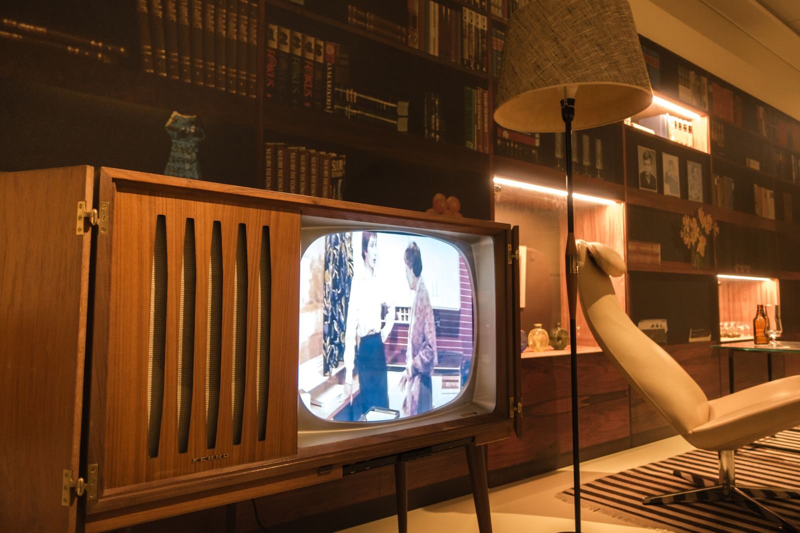 Cozy room with vintage wooden television and modern interior design elements, creating a nostalgic ambiance.