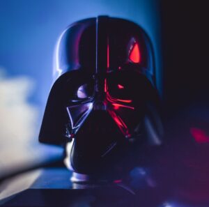 Close-up of a Darth Vader mask with striking lighting effects, showcasing cinematic appeal.