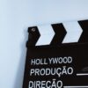 Close-up vertical shot of a clapperboard with text, ideal for film and media themes.