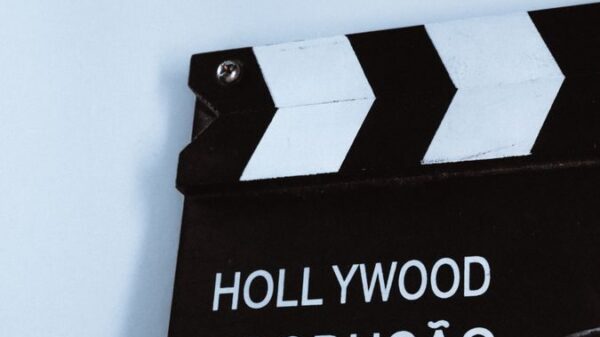 Close-up vertical shot of a clapperboard with text, ideal for film and media themes.