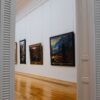 Explore the elegance of an art gallery interior with framed paintings on display.