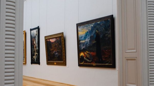 Explore the elegance of an art gallery interior with framed paintings on display.