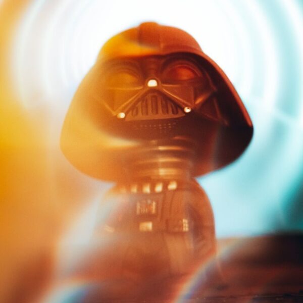 Miniature Darth Vader figurine with vibrant light effects adds a touch of fantasy.