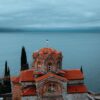 Serene view of St. John at Kaneo with Lake Ohrid in the background, North Macedonia.