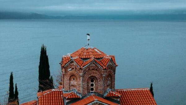 Serene view of St. John at Kaneo with Lake Ohrid in the background, North Macedonia.