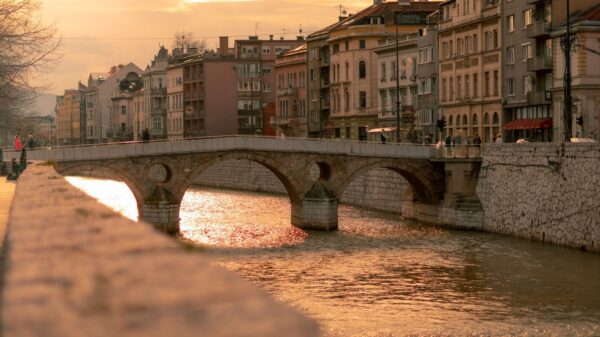 Beautiful sunset view of the historic Latin Bridge over Miljacka River in Sarajevo, Bosnia.