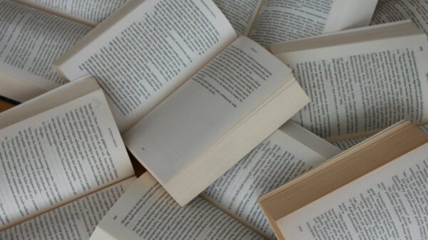 pile of open paperback books