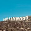 Famous Hollywood Sign under clear blue skies in Los Angeles, CA.