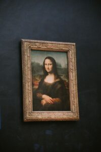 Iconic painting of Mona Lisa displayed in a Paris museum setting.