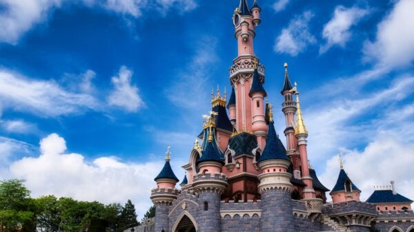 Magical view of the iconic Disneyland Paris castle with a vibrant blue sky.