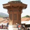 A vibrant scene at the Gazi Husrev-beg's Sebilj Fountain in Sarajevo, capturing cultural essence and tourism.