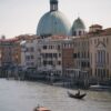 Stunning view of Venice canal featuring iconic architecture and gondolas, capturing the essence of Italy.