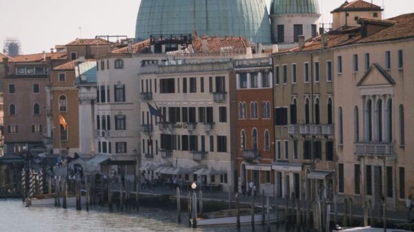 Stunning view of Venice canal featuring iconic architecture and gondolas, capturing the essence of Italy.
