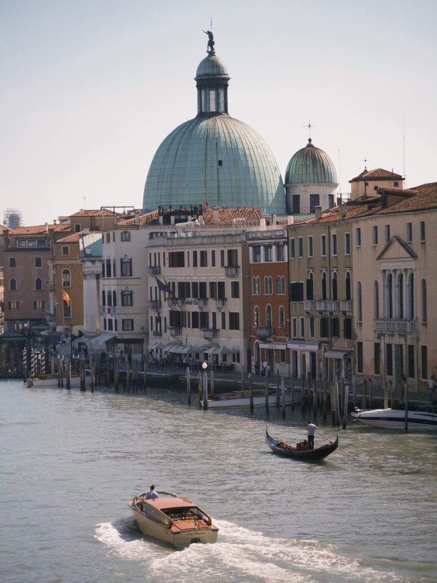 Stunning view of Venice canal featuring iconic architecture and gondolas, capturing the essence of Italy.