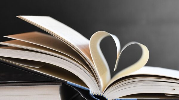 Open book with pages forming a heart, symbolizing love for reading and literature.
