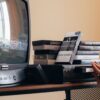 Vintage scene with a VHS player, tapes, and an old CRT TV creating a nostalgic vibe.